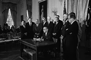 Thomas H Prints: Lyndon Johnson Signing Law in Front of Senators