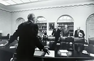 Lyndon Speaking with Colleagues
