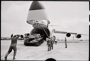 Unloading Prints: M-41 Tank Is Unloaded From Cargo Plane