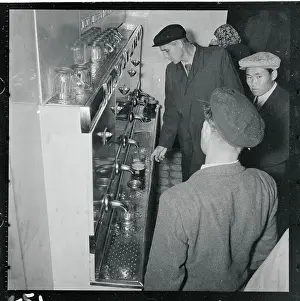 Machine Pouring Beer for a Customer