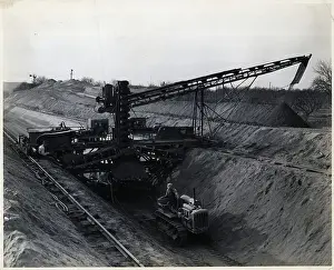 Heavy Prints: Machine Smoothing Side Of Canal In Progr