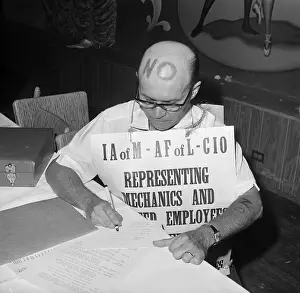 Airline Prints: Machinist with Sign Votes on Contract