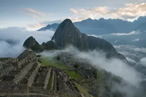 Machu Picchu at Sunrise with rolling fog and clouds