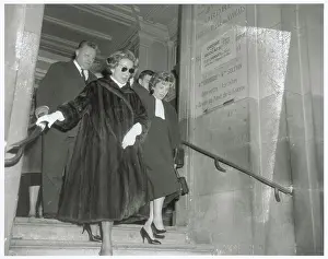Madame Jean Walter Exiting Courthouse with Legal Officials