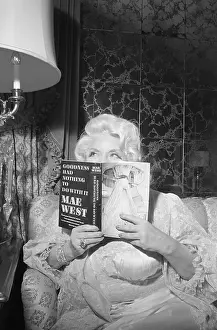 Mae West Displaying Her New Book