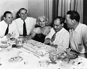 Mae West and Manager Cutting Cake