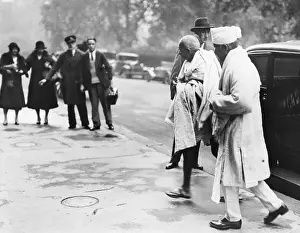 Prints of (Original Caption). India: Gandhi Confers With Lord Irwin For Three Hours Mahatma Gandhi Through the Lens: Mahatma Gandhi Alongside Officials and Strolling from Limousine