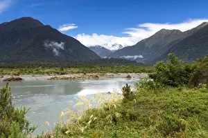 West Coast Region Prints: Mahitahi River with views towards the Bannock Brea Range and the snow-capped Mount Stratford
