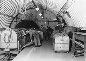 Prints of 1928: Mail in containers being loaded into a train at Mount Pleasant depot, London, 9th February 1928. (Photo by E. Bacon/Topical Press Agency/Getty Images) Topical Press Agency Prints: Mail Train