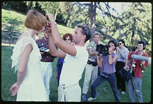 Makeup Artist Adjusting Model's Hair on Outdoor Shoot