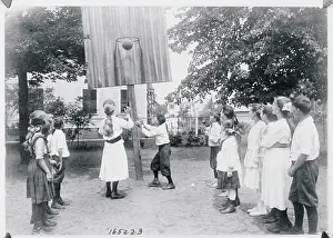 Prints of (Original Caption). Children's games and sports in the Spring.Playing basketball-caging a basket Hoops Through Time: A Visual Journey of Basketball History: Making a Basket