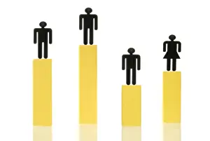 Varying Prints: Three male figures and one female figure standing on different coloured columns of various heights