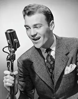Male singer holding microphone