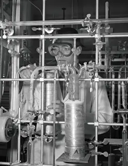 Candidate Terms Prints: Male student in chemistry laboratory performing high vacuum distillation at low temperature