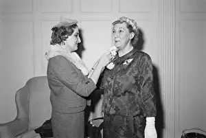 Mamie Eisenhower Being Pinned by Helen Thomas