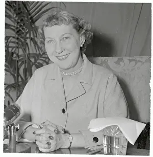 Mamie Eisenhower Smiling and Sitting with Her Hands Clasped
