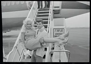 Mamie Van Doren Being Carried by Anthony Santoro on Airplane Steps