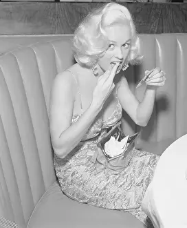 Mamie Van Doren Checking Lipstick in Mirror