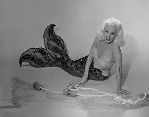 Mamie Van Doren Lying on Ground in Mermaid Suit