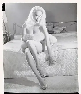 Mamie Van Doren Posing on a Bed