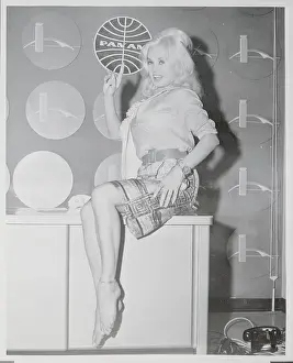 Mamie Van Doren Posing Near Pan Am Logo