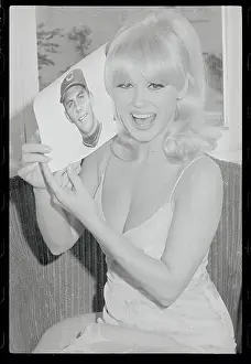 Mamie Van Doren Posing with Picture in Her Hand