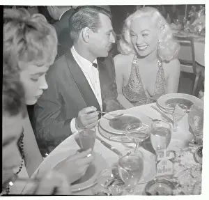 Mamie Van Doren and Ray Anthony at Sitting Dinner Table