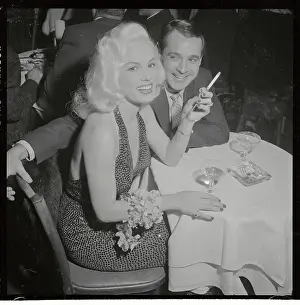 Mamie Van Doren and Ray Anthony Sitting at Table