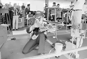 Man Aiming Rifle