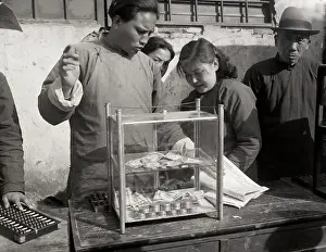 Nanjing Prints: Man With American Currency In Glass Box