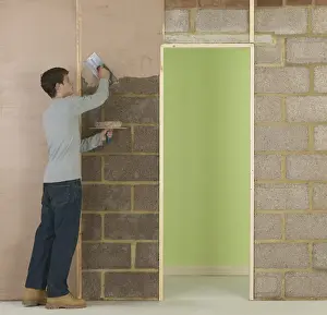 Brick Wall Prints: Man applying plaster to wall