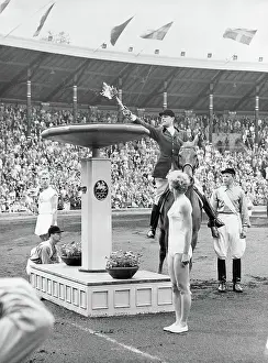 Equestrian Prints: Man Applying Torch to Olympic Flame