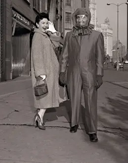 Shelter Prints: Man in Atomic-Shelter Suit with Woman Laughing