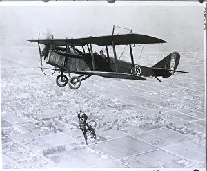 Stunt Prints: Man On Bicycle Falling From Plane