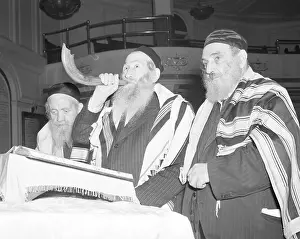 Man Blowing Shofar Indicating the Start of Yom Kippur