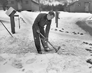 Camp Prints: Man Breaking Ice With a Pickaxe