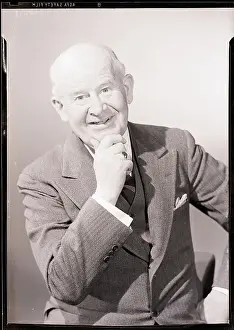 Hand On Chin Prints: Man in Business Suit