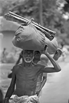 East Pakistan Prints: Man Carrying Belongings On Head