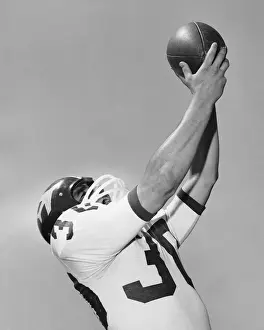 Catching Prints: Man catching football