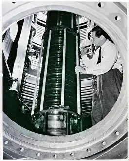 Vacuum Tube Prints: Man in Charge of Cyclotron Tests Tube