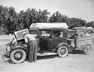 Man Checking Car for Problems