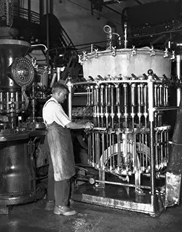 Man Cleaning Glass-Lined Beer Tank