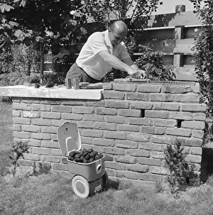 Huntington Prints: Man Cooking on Backyard Barbecue