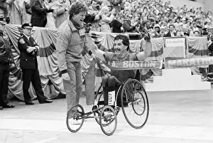 Man Crossing Finish Line In Wheelchair