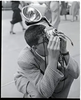 Flash Prints: Man Crouches To Snap Photo
