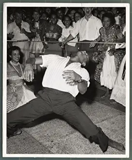 Man Dancing Under Limbo Stick