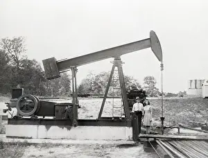 Illinois Prints: Man & Daughter Stand Under Old Oil Drill
