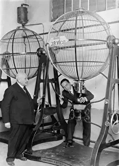 Sphere Prints: Man Demonstrates Speres Used for Lottery