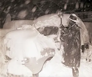 Digging Prints: Man Digging Automobile Out of Snow