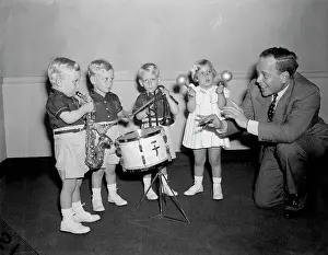 Bandleader Prints: Man Directs Children Playing Instrument